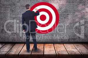 Rear view of businessman standing in front of bull's eye