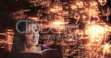 Digitally generated image of smiling college student looking at glowing math equations