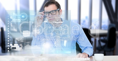 Digital composite image of businessman looking at virtual screen