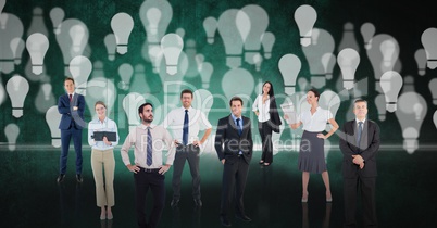 Digital composite image of business people over light bulb background