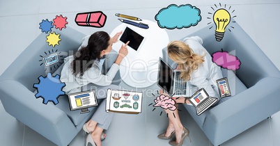 Various icons over businesswomen using laptops on couch