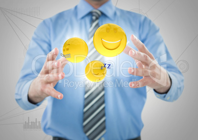 Business man mid section with flares and emojis between hands against white network