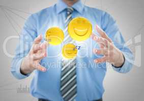 Business man mid section with flares and emojis between hands against white network