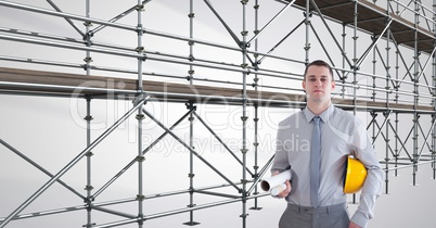 engineer with the hat on his arm in front of 3D scaffolding