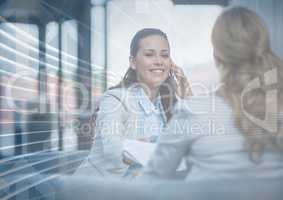 Business woman on phone behind arrow graphic overlay