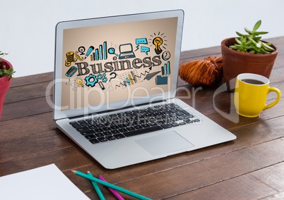 Computer on table showing blue and yellow business doodles against cream background
