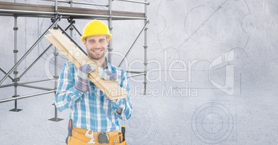 Happy builder with wood in front of 3D scaffolding