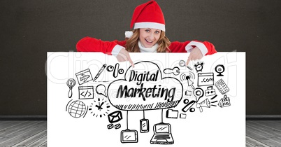 Portrait of happy woman wearing Santa hat showing digital marketing icons on placard