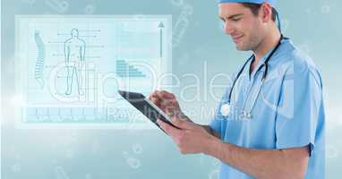 Male surgeon using digital tablet against medical diagram