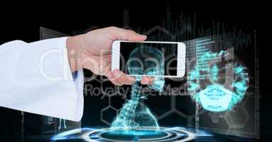 Doctor's hand holding smart phone with skeleton seen through it