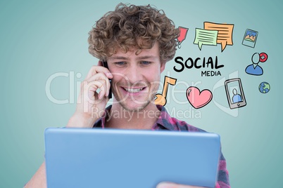 Smiling man using tablet PC and smart phone with social media icons in background