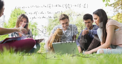 Digitally generated image of formulas with college students studying while sitting on field in backg