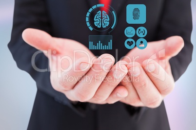 Digitally generated image of various icons on hand of businessman