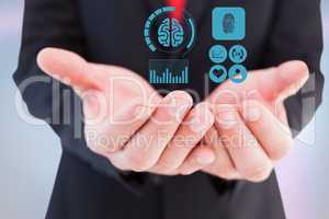 Digitally generated image of various icons on hand of businessman