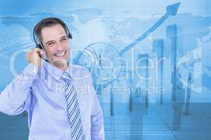 Digitally generated image of businessman using headphones with employees and graph in background
