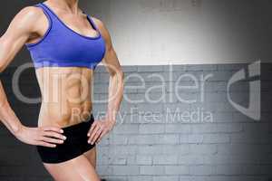 Midsection of sporty woman with perfect abdominal muscles