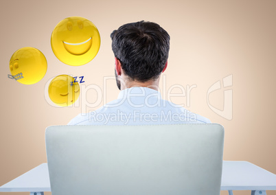 Back of man sitting with emojis against cream background