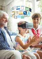 Child wearing VR Virtual Reality Headset with Interface and grandparents