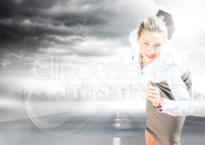 Business woman running with briefcase on road with skyline and storm