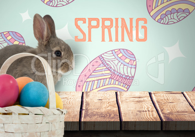 Spring text with rabbit with eggs basket in front of pattern