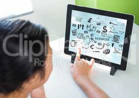 Woman touching tablet on stand showing black business doodles and sky