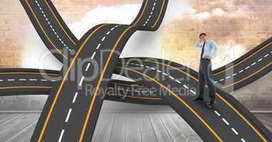 Digital composite image of confused businessman on roads