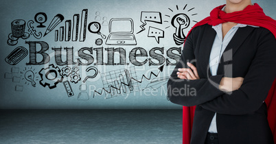 Business woman superhero mid section with arms folded against blue wall with business doodles