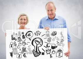 Elderly couple holding card with ideas money and business graphic drawings