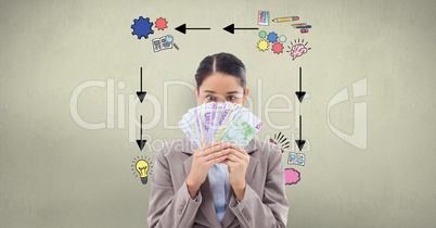 Businesswoman holding banknotes against signs on wall
