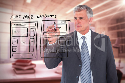 Composite image of businessman writing with black marker