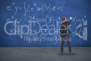 Composite image of rear view businessman writing with chalk