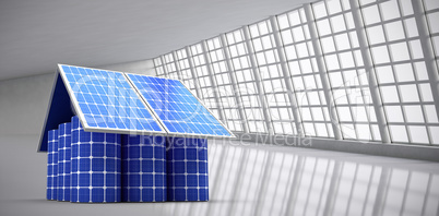 Composite image of 3d image of model home made from solar panels and cells