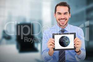 Composite image of smiling businessman showing his digital tablet