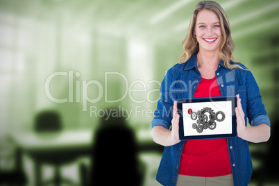 Composite image of smiling woman holding tablet pc