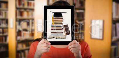 Composite image of woman holding digital tablet in front of her face