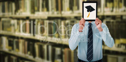 Composite image of businessman holding digital tablet in front of face