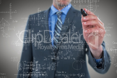 Composite image of businessman writing on digital screen