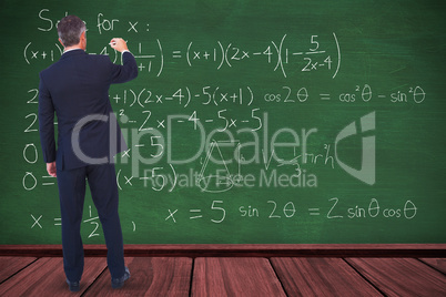 Composite image of businessman writing with chalk on white background