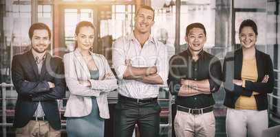 Portrait of businesspeople standing with arms crossed