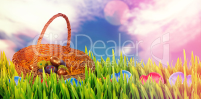 Composite image of easter eggs in paper nest basket