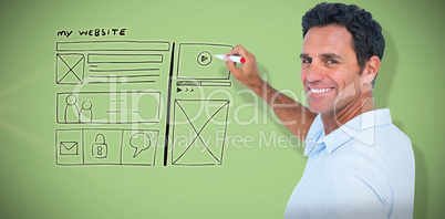 Composite image of handsome man writing something with red markers