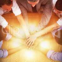High angle view of business team stacking hands