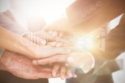 Close-up of business colleagues stacking hands