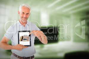 Composite image of mature student showing tablet pc