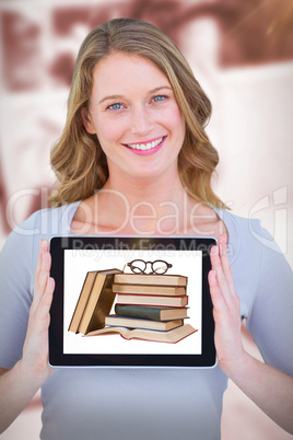 Composite image of portrait of smiling woman with tablet