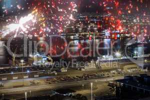 Composite image of colourful fireworks exploding on black background