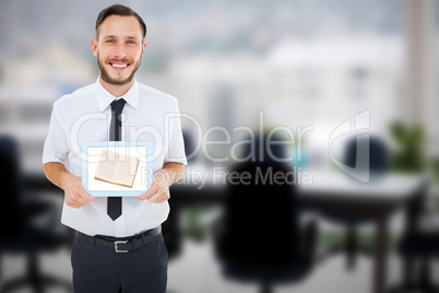 Composite image of geeky businessman showing his tablet pc