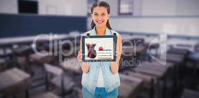 Composite image of student showing tablet pc