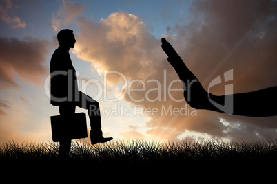 Composite image of businessman with briefcase walking over white background