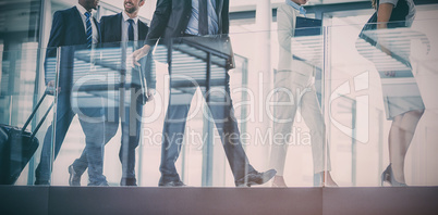 Businesspeople walking in office